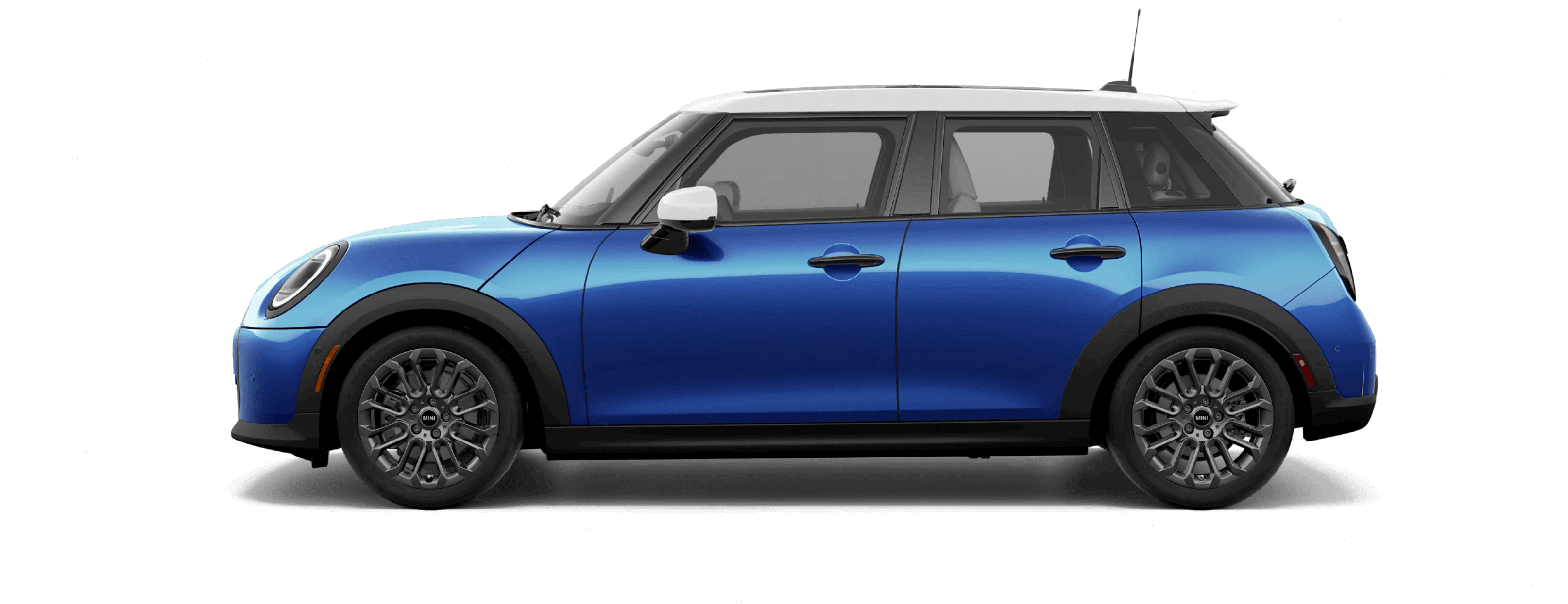 Side view of a MINI Cooper S 4 Door in the Icy Sunshine Blue body color, facing left with its shadow underneath it. 