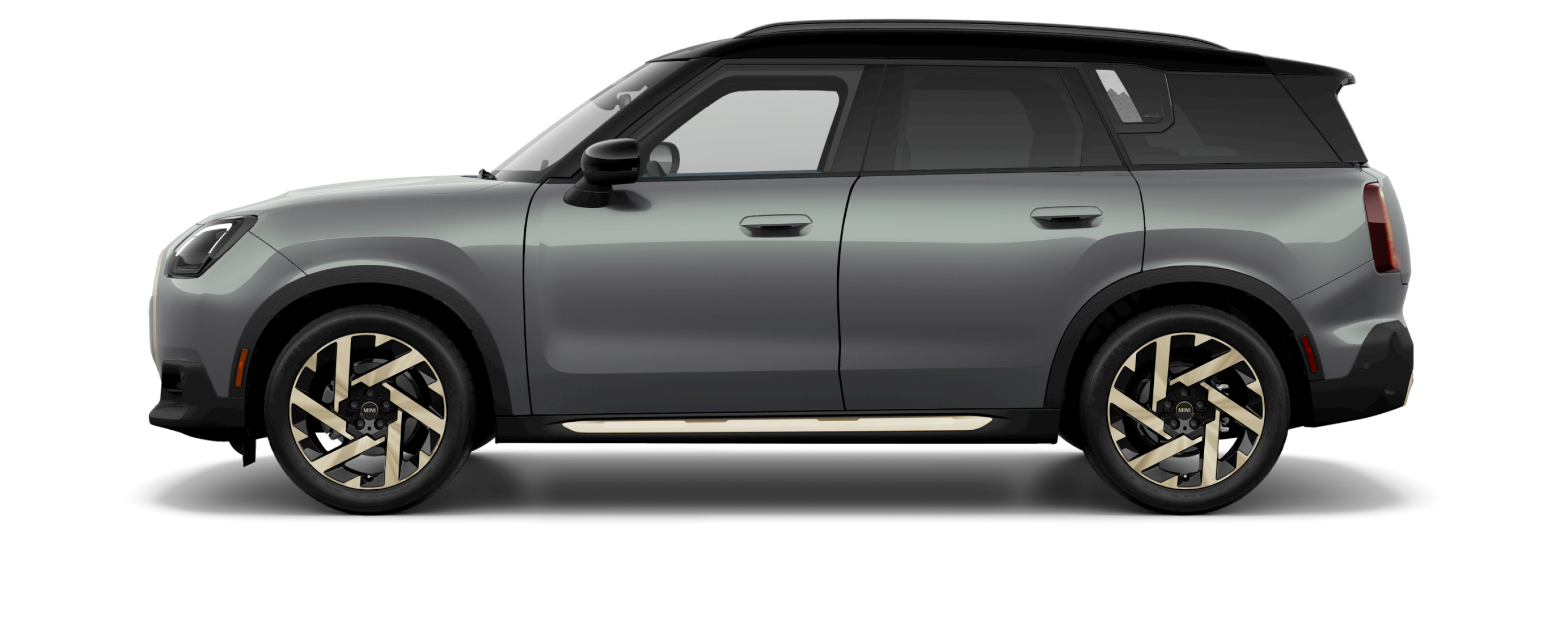 Side view of a MINI Countryman S ALL4 in the Smokey Green body color, facing  left with its shadow underneath it.